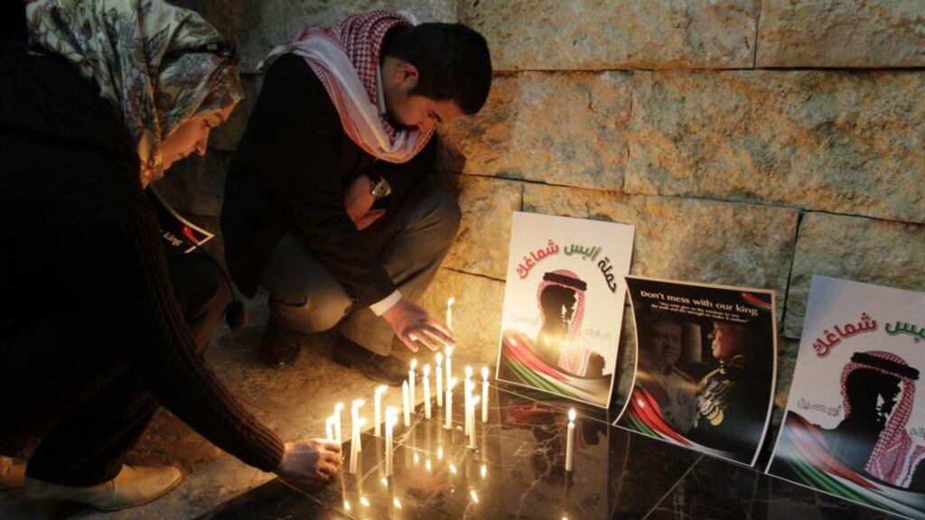 People take part in a candlelight vigil in the Jordanian capital Amman in  solidarity with the pilot recently murdered by the Islamic State  group. Photograph: Khalil Mazraawikhalil/AFP/Getty Images.