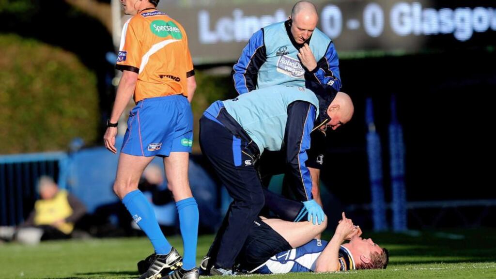 Leinster’s Brian O’Driscoll receives treatment during the RaboDirect Pro12 play- Off against Glasgow at the RDS. Photograph: James Crombie/Inpho