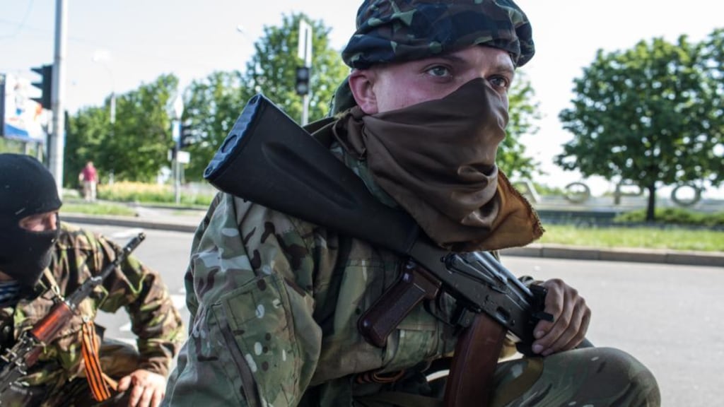 Pro-Russian separatist fighters take positions outside the main regional airport in Donetsk, the scene of an hours-long battle between separatists and Ukrainian forces yesterday. Photograph: Brendan Hoffman/Getty Images