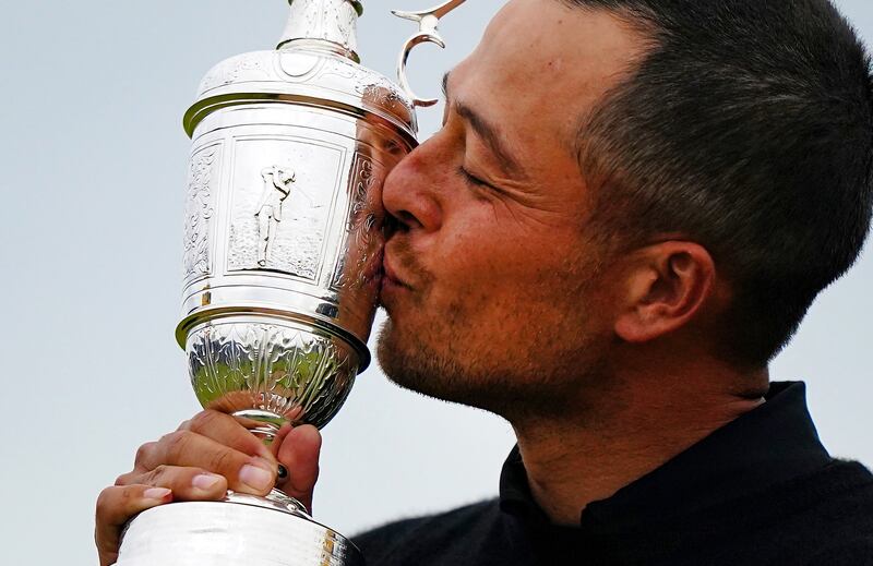 Xander Schauffele kisses the Claret Jug after his win at Royal Troon. Photograph: Zac Goodwin/PA Wire