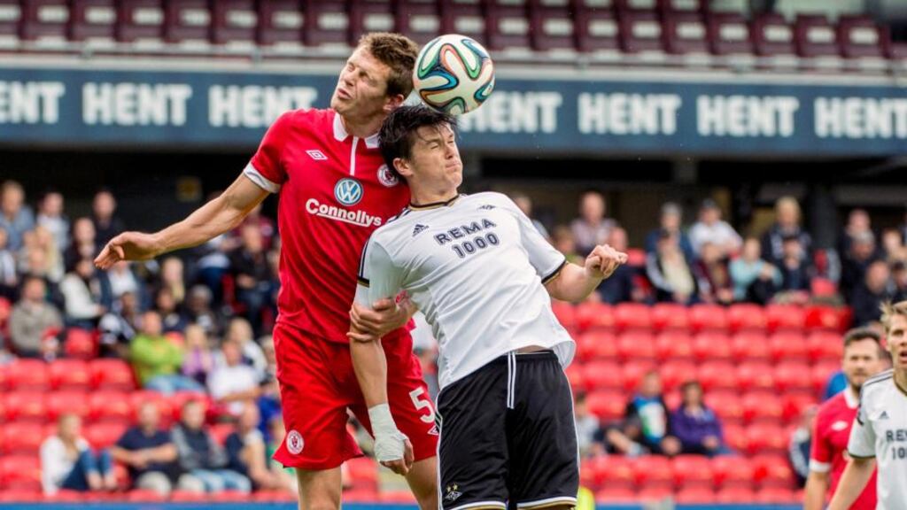 Sligo’s Evan McMillan outjumps Rosenborg’s Andre Helland during last night’s clash at the Lerkendal Stadion, Trondheim, Norway. Photograph: Ned Alley/Inpho