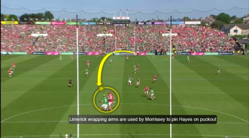 Dan Morrissey breaking up the Cork puckout by wrapping up Brian Hayes outside the referee's eyeline