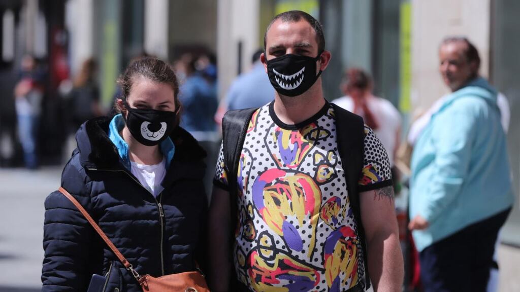 A couple wearing face masks shopping in Dublin’s Henry Street. Photogrpah: Niall Carson/PA Wire