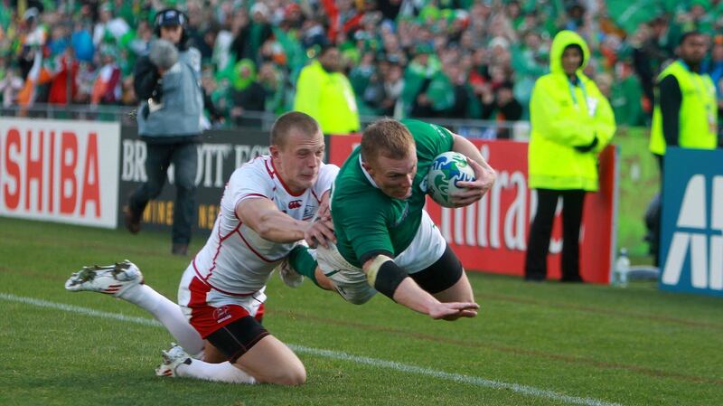 Keith Earls dives to score for Ireland against Russia at the 2011 Rugby World Cup. Photograph: Dan Sheridan/Inpho