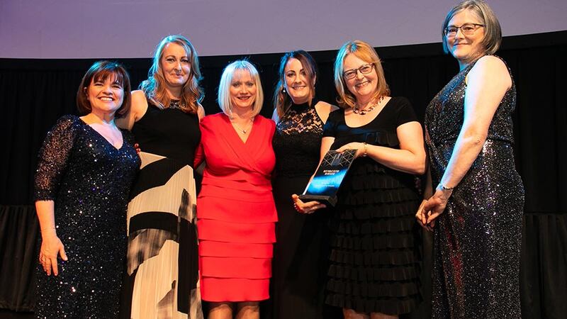 Breda O’Toole, Awards Judge, presents the Best Public Sector HR Initiative award to the Tallaght University Hospital and WALK teams.