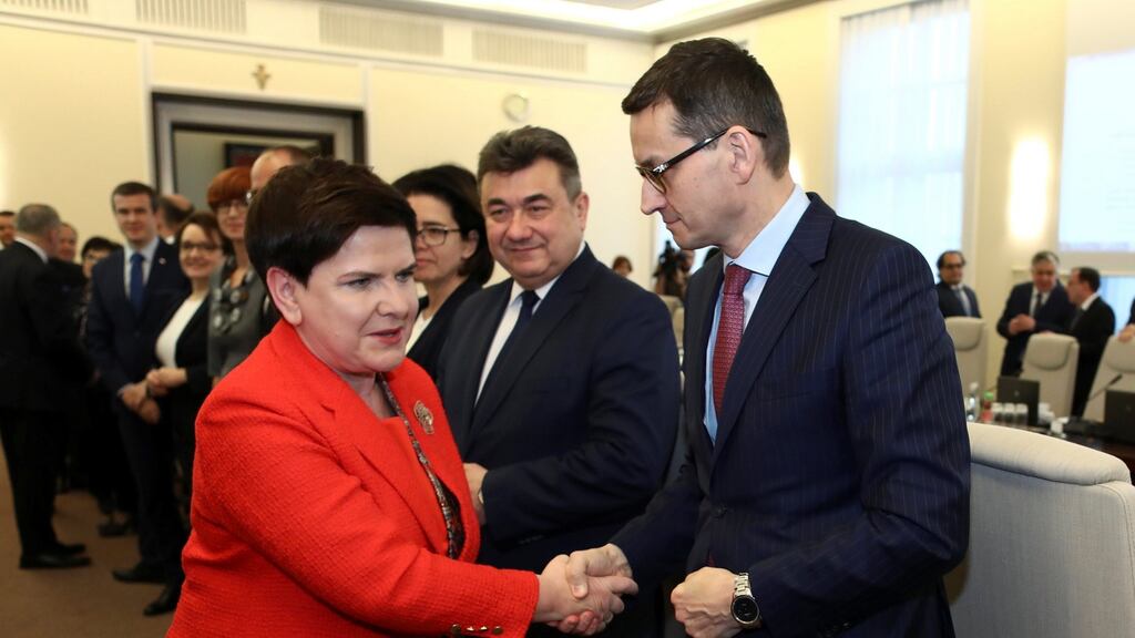 Poland’s prime minister Beata Szydlo greeting finance minister Mateusz Morawiecki, who is tipped to succeed her, in Warsaw on Tuesday. Photograph: Slawomir Kaminski/Agencja Gazeta