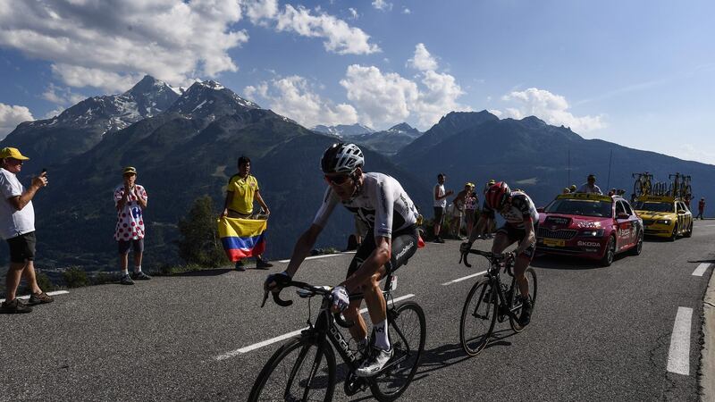 Martin pursues Froome during the 11th stage of the 105th edition of the Tour de France in 2018. Photo: Jeff Pachoud/AFP via Getty Images
