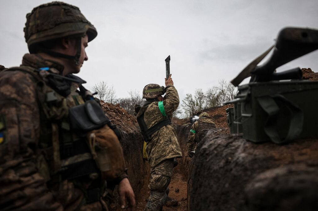 A Ukrainian infantryman of the 57th Separate Motorised Infantry Brigade uses a periscope to observe enemy positions from a trench at an undisclosed location near the town of Bakhmut, Donetsk region, eastern Ukraine, this week.  Photograph: Anatolii Stepanov/AFP/Getty