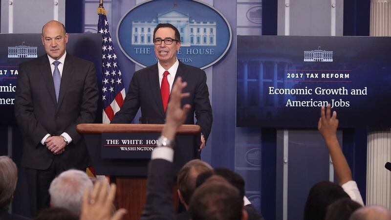 US national economic director Gary Cohn (left) and treasury secretary Steven Mnuchin speak about Donald Trump’s tax reform plan at the White House on Wednesday. Photograph: Mark Wilson/Getty Images