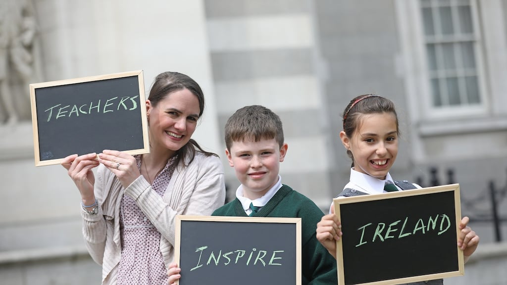 Cliodhna Halpin, a learning support teacher at St Joseph’s National School, Bonnybrook, along with pupils Max Maples and Leannah McCarthy help launch a DCU initiative to celebrate the ransformative role of teachers. Photograph: Julien Behal