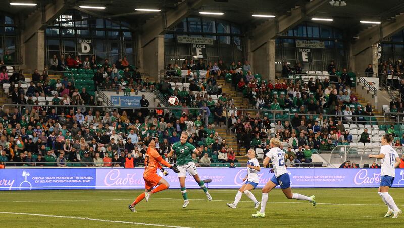 Ireland's Lily Agg heads past Tina-Riikka Korpela of Finland to score in Tallaght. Photograph: Tom Maher/Inpho