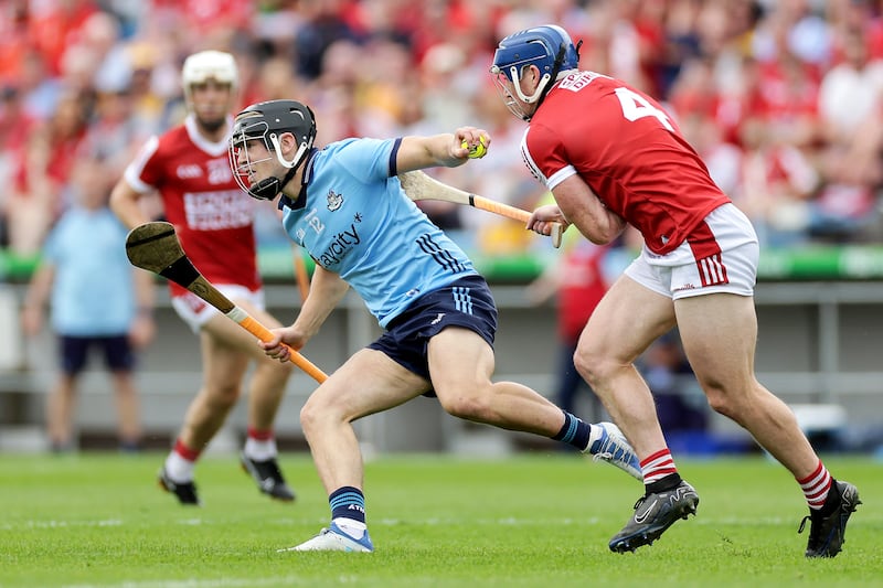 Seán O'Donoghue of Cork battles with Sean Currie. Photograph: Laszlo Geczo/Inpho