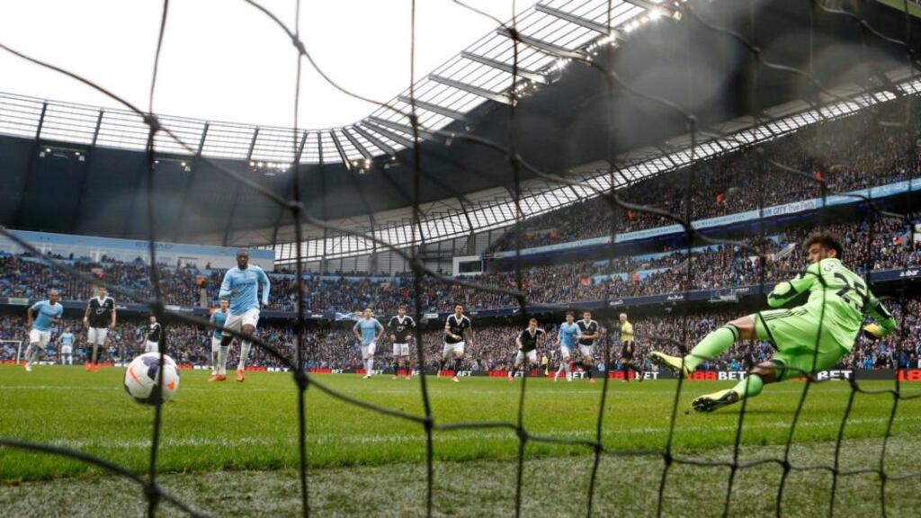 Manchester City’s Yaya Toure  scores his penalty. Photograph: Darren Staples/Reuters