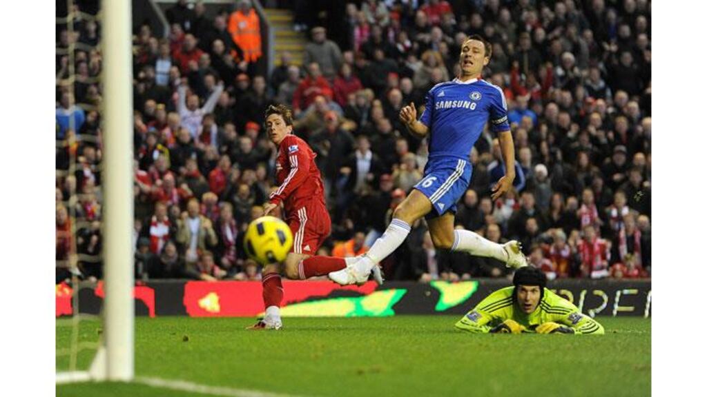 Fernando Torres fires home Liverpool’s first goal as the revival at Anfield continues to gather pace. Photograph: Martin Rickett/PA Wire