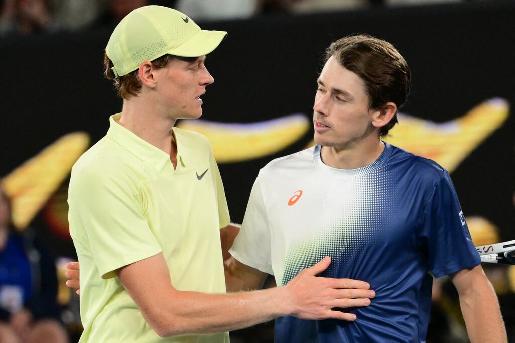 Italy's Jannik Sinner and Australia's Alex De Minaur meet at the net after his victory in their men's singles quarter-final match at the Australian Open in Melbourne. Photograph: Yuichi Yamazaki/AFP via Getty Images