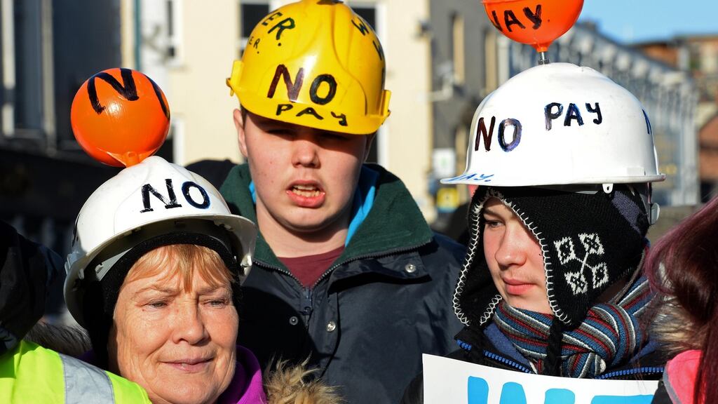 People taking part in the anti-water charges protest in Dublin. Sinn Féin has published extracts from a legal opinion it has received which it says confirms water charges can be scrapped. File photograph: Eric Luke/The Irish Times