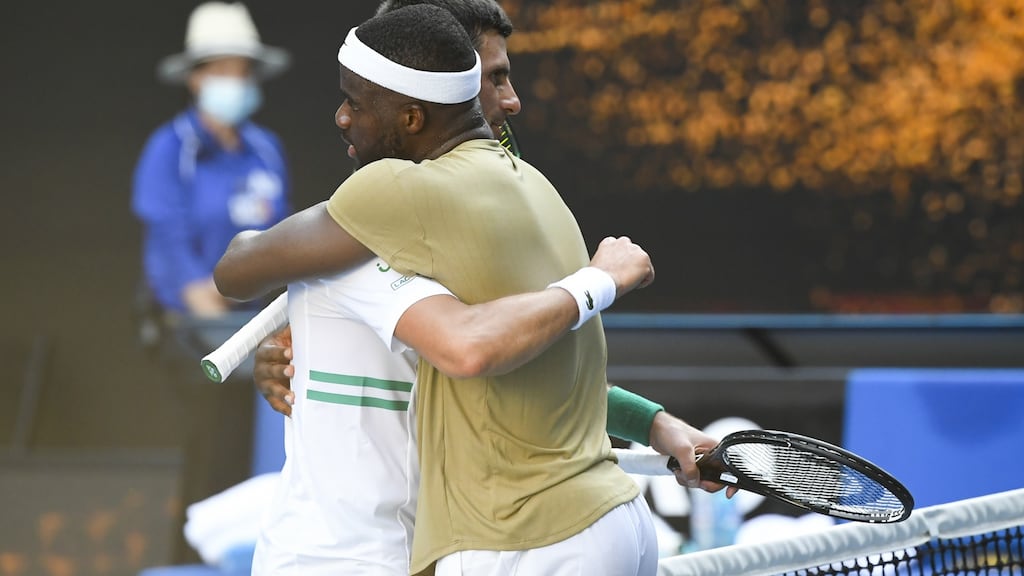 Novak Djokovic and Frances Tiafoe after their match at Melbourne Park. Photograph: EPA