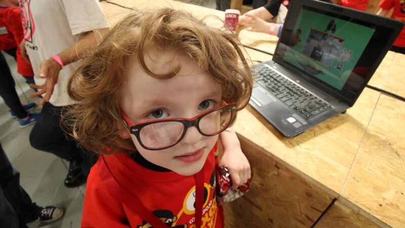 Thomas Duggan from Portarlington at Coder Dojo in the RDS with his project, “All About Me”. Photograph: Nick Bradshaw