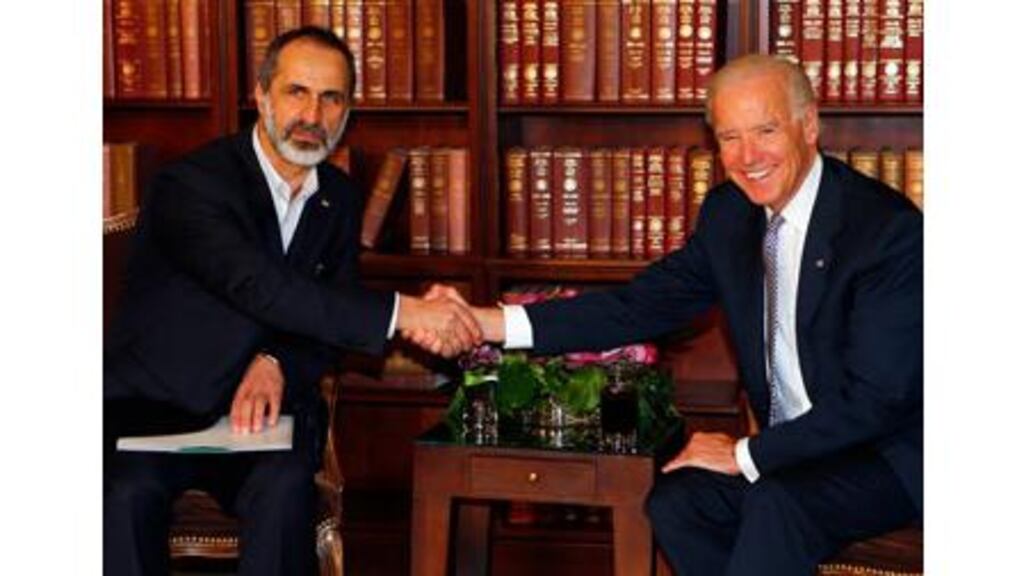 Sheikh Moaz Alkhatib, president of the National Coalition of Syrian Revolutionary and Opposition Forces and US vice-president Joe Biden (R) meet for bilateral talks during the 49th Conference on Security Policy in Munich. Photograph: Reuters.