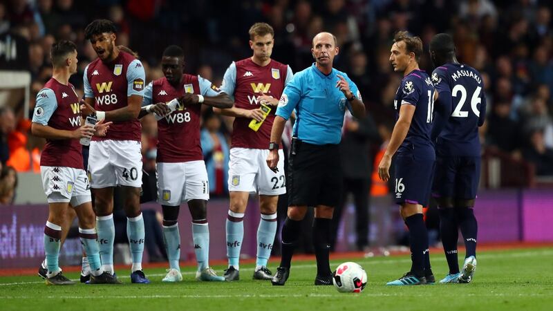Mike Dean sends off West Ham’s Arthur Masuaku at Villa Park. Photograph: Michael Steele/Getty