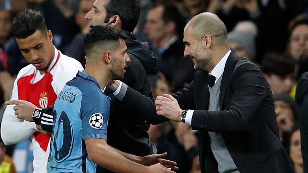 Manchester City’s Sergio Aguero is congratulated by his manager Pep Guardiola after being substituted. Photograph: Lee Smith/Reuters