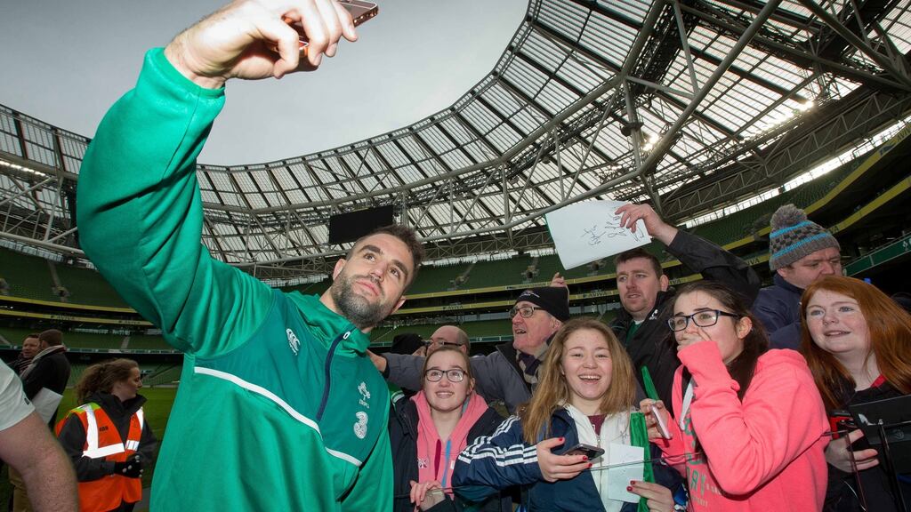 Scrumhalf Conor Murray takes a selfie with young supporters during Ireland’s open training session at the Aviva Stadium. Photograph: Morgan Treacy/Inpho