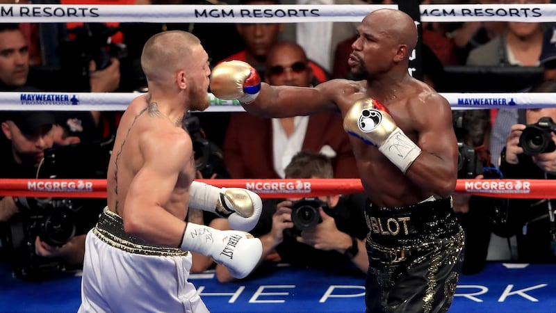 Floyd Mayweather throws a punch at Conor McGregor during their super welterweight bout at T-Mobile Arena in Las Vegas, Nevada in August 2017. Photograph: Sean M Haffey/Getty Images