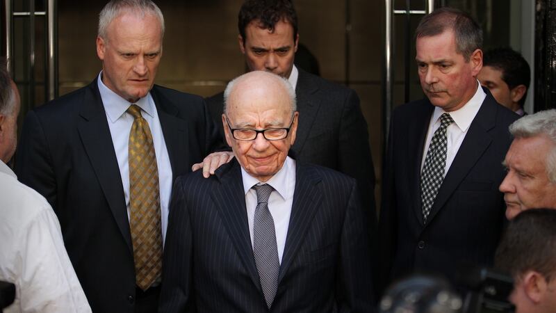 Rupert Murdoch (C) looks down as he leaves the One Aldwych Hotel after meeting with the family of murdered school girl Milly Dowler in 2011 in London. Photograph: Peter Macdiarmid/Getty Images