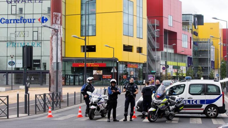 French police outside a shopping centre in the Villeneuve La Garenne area near Paris, France. Some 18 people have been freed after an attempted robbery at a Primark outlet in the centre. Photograph: Etienne laurent/EPA.