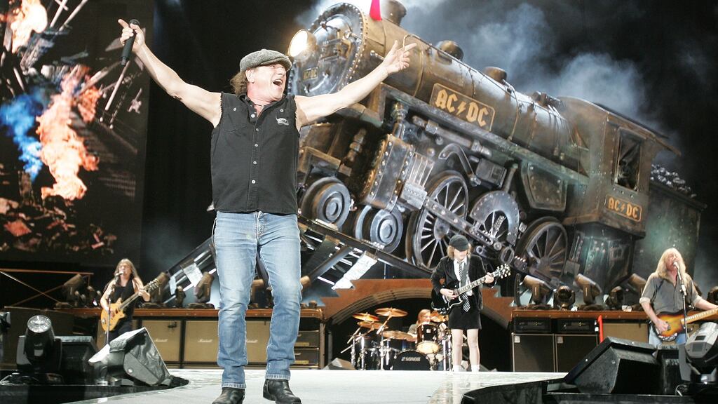 AC/DC singer Brian Johnson with his bandmates on stage at Punchestown during their Black Ice world tour in 2009. Photograph: Alan Betson