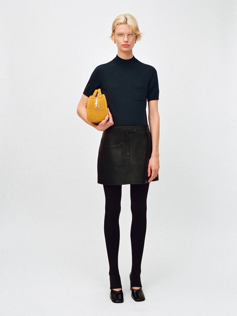 Black T-shirt, €39, leather mini skirt, €249, and suede crossbody bag, €199