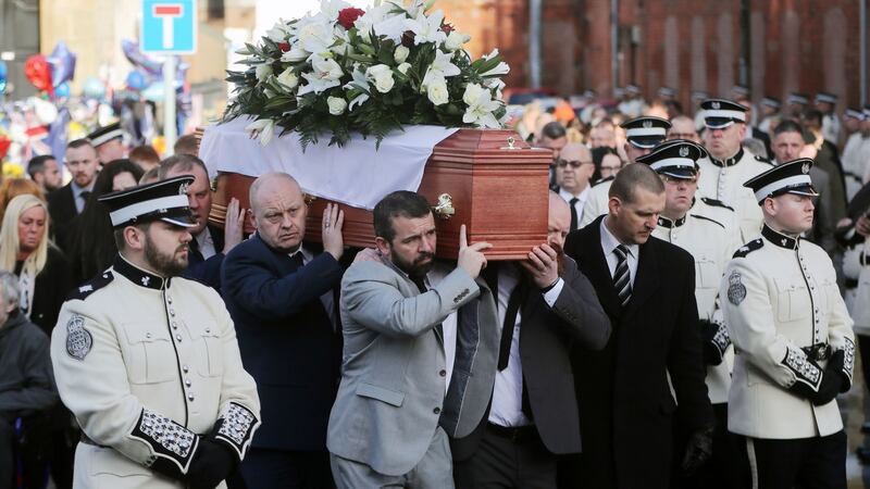 Ian Ogle’s coffin is carried past the scene of his murder at Cluan Place in east Belfast ahead of his funeral.  Photograph: Niall Carson/PA Wire