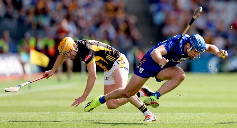 Shane O'Donnell eludes the challenge of Kilkenny's Richie Reid during the semi-final in which O'Donnell couldn't step the bleeding from a badly cut finger. Photograph: James Crombie/Inpho ames Crombie