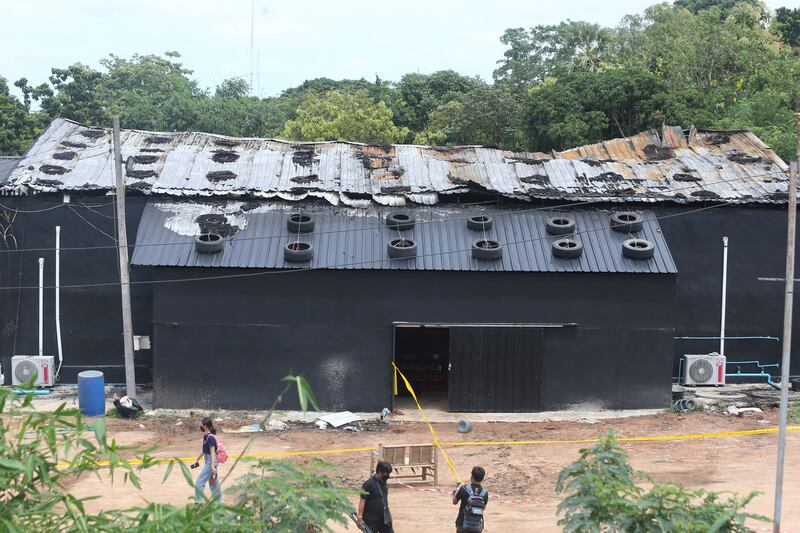 Exterior damage from the fire at the Mountain B pub. Several witnesses described seeing smoke and fire on the ceiling near the stage, followed by explosions. Photograph: Anuthep Cheysakron/AP