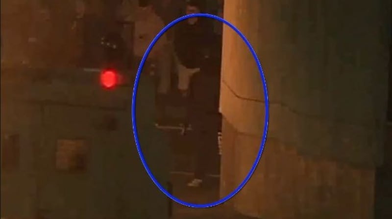 The CCTV footage also shows the gunman at the corner and an individual picking up something from the ground on the same corner.