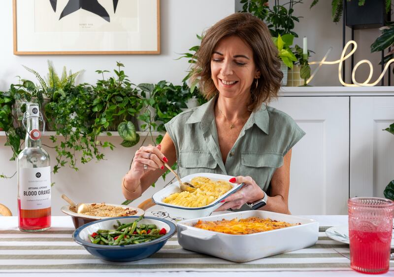 Nik sets the table by using her own dishes to create a stylish-looking meal