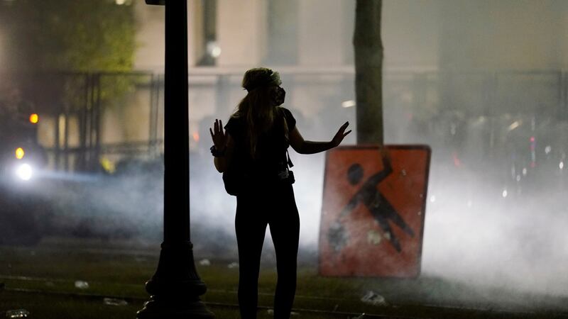 A protester in Kenosha, Wisconsin, on Tuesday night. Photograph: Morry Gash/AP