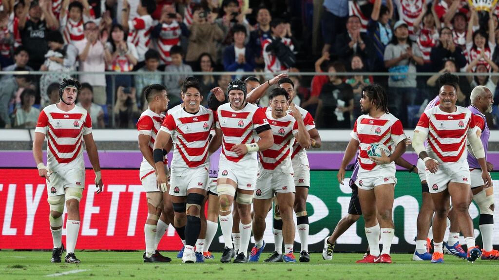 Japan players celebrate their sides third try during the Rugby World Cup quarter-final against Scotland. Photo: Craig Mercer/Getty Images
