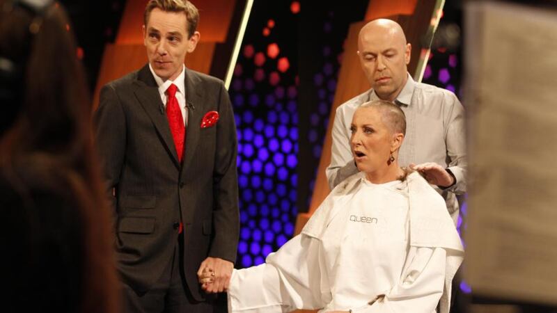 Mrs O’Donnell reacts after having her hair shaved live on RTE’s Late Late show. Photograph: Andres Poveda/The Irish Cancer Society
