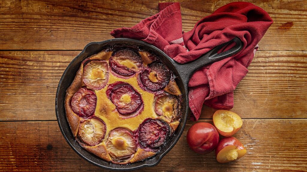 Clafouti: Once baked the plums burst, their juices staining the pancake batter with flushes of bright ruby. Photograph: Harry Weir