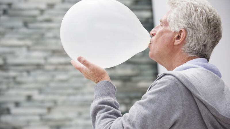 Blowing up a balloon while seated could create positive end-expiratory pressure similar to that created in mechanical ventilation. Photograph: Getty
