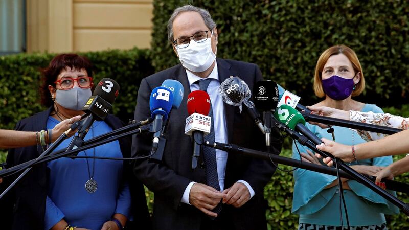 Former Catalan regional president Quim Torra (centre) delivers a press conference after his meeting with former Catalonia’s parliament president Carme Forcadell (right) and former Catalan regional minister Dolors Bassa (left) in Barcelona on Tuesday. Photograph: Toni Albir/EPA
