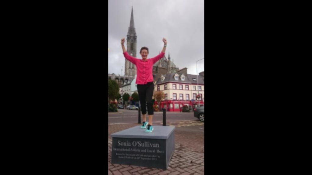 Life-like: Sonia O’Sullivan poses on the plinth in Cobh where a bronze statue in her image will be unveiled this weekend. Photograph: Cobh Tourism