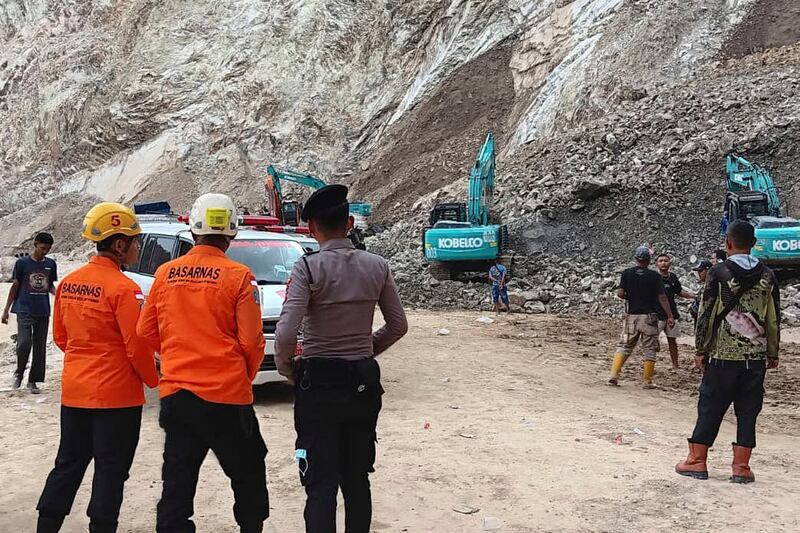 Rescuers at the site of a collapsed natural stones quarry in Cirebon district, West Java province, Indonesia. Photograph: Basarnas via AP