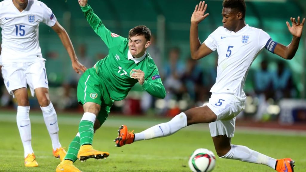 Republic of Ireland’s Jamie Aherne gets his shot away despite the challenge of England captain Reece Oxford during the Uefa European U17 Championship at Beroe Stadium, Stara Zagora, Bulgaria. Photo: Kostadin Andonov/Inpho