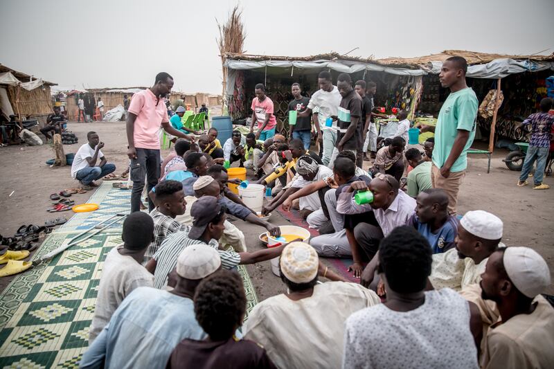 Sudanese refugees, who have recently fled Sudan's war, break their fast in a transit centre in Renk, South Sudan. Photograph: Sally Hayden