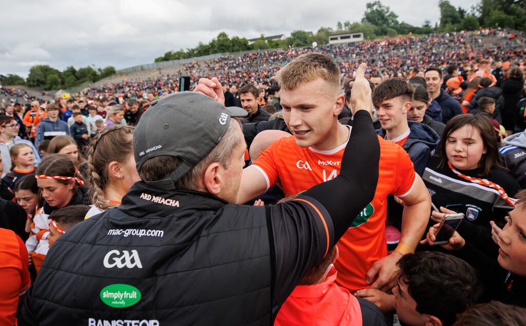 Armagh’s Rian O'Neill and manager Kieran McGeeney celebrate after the win over Donegal in Clones. Photograph: James Crombie/Inpho