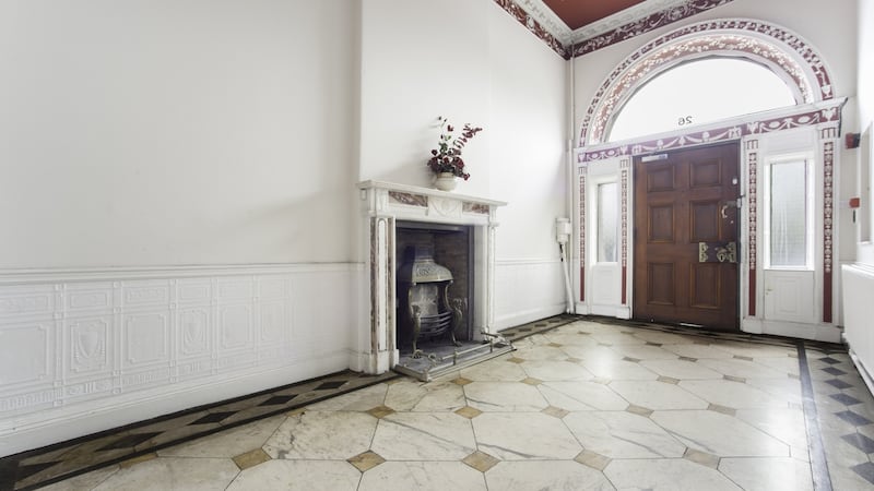 A Sienna marble floor and Adams-style fireplace greet you as does the decorative frieze above and on the interior of the front fanlight