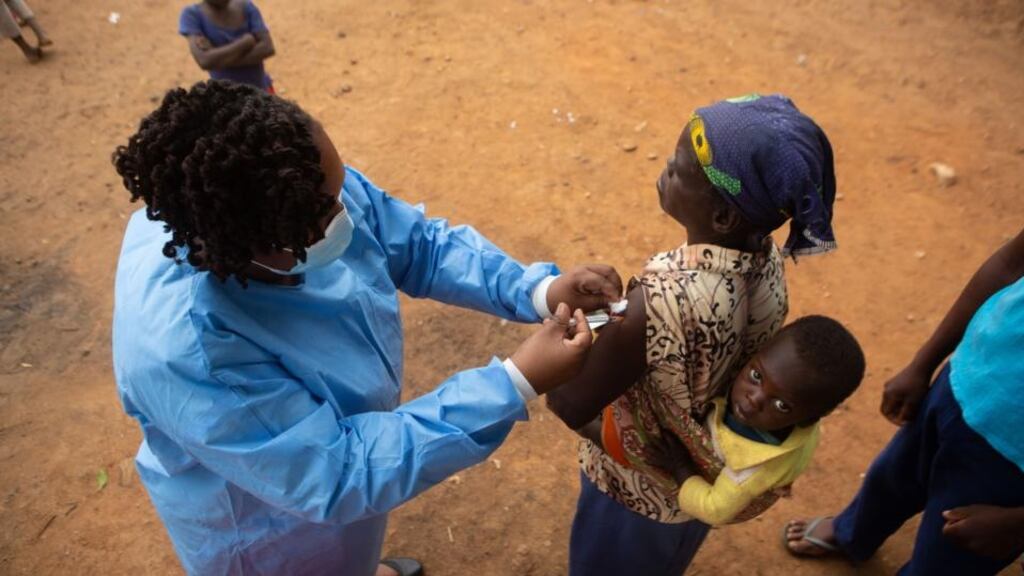 A woman receives a vaccine dose at a shopping centre near Buwi Secondary School in Chinhoyi, Zimbabwe, on December 15th. Photograph: Tafadzwa Ufumeli/Getty Images