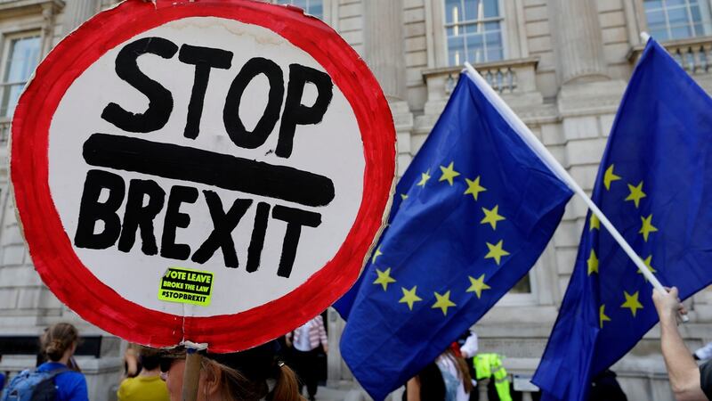 Anti-Brexit demonstrators wave banners and flags outside the Cabinet Office in London on Friday. Photograph: AP